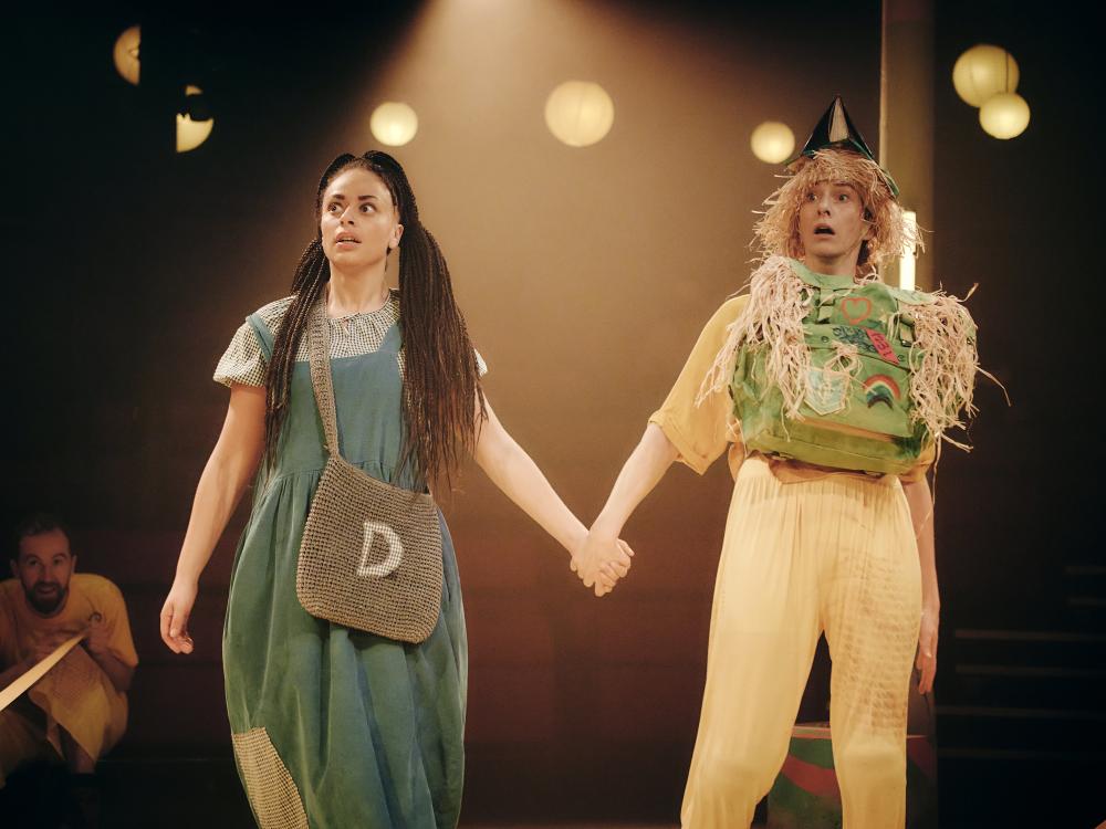 Dorothy and Scarecrow walk to the Emerald City.