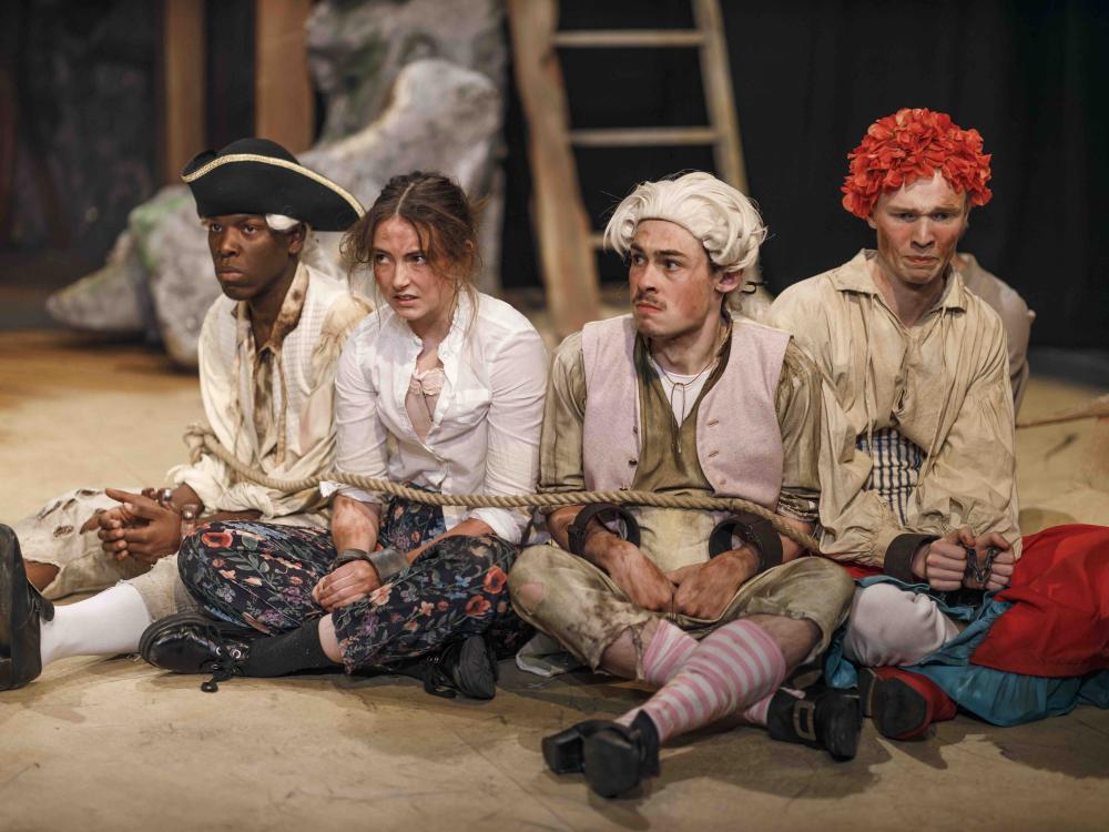 4 people in disheveled clothing 