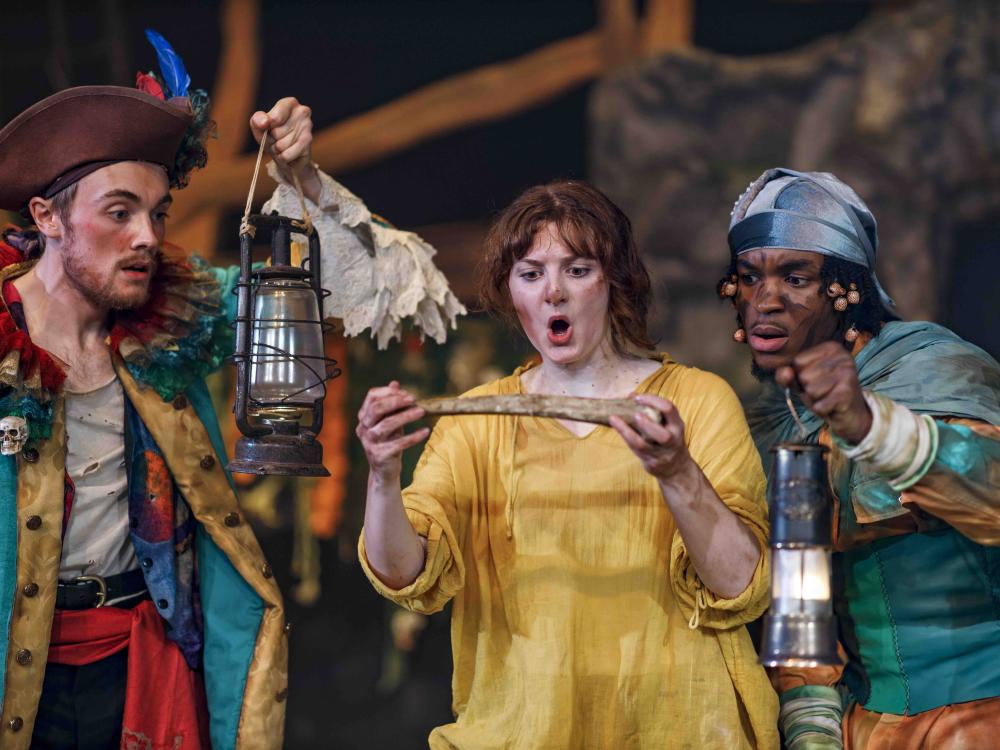 group of pirates looking at a stripe of paper