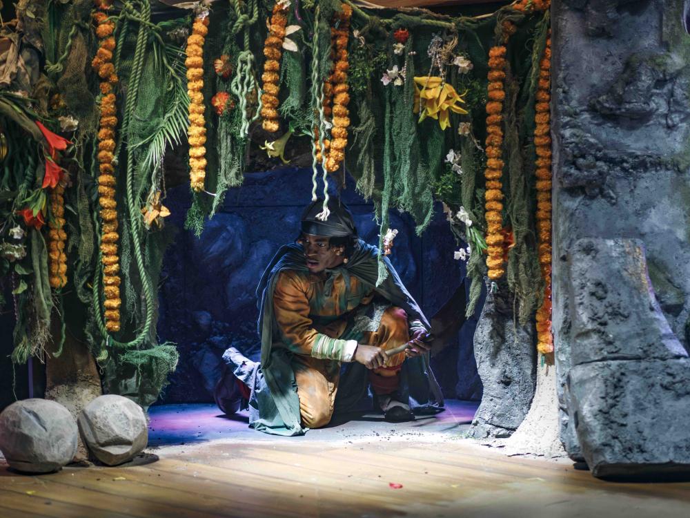 person hiding in cave 