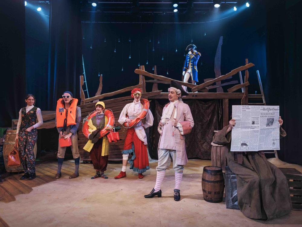 people wearing life jackets at dock